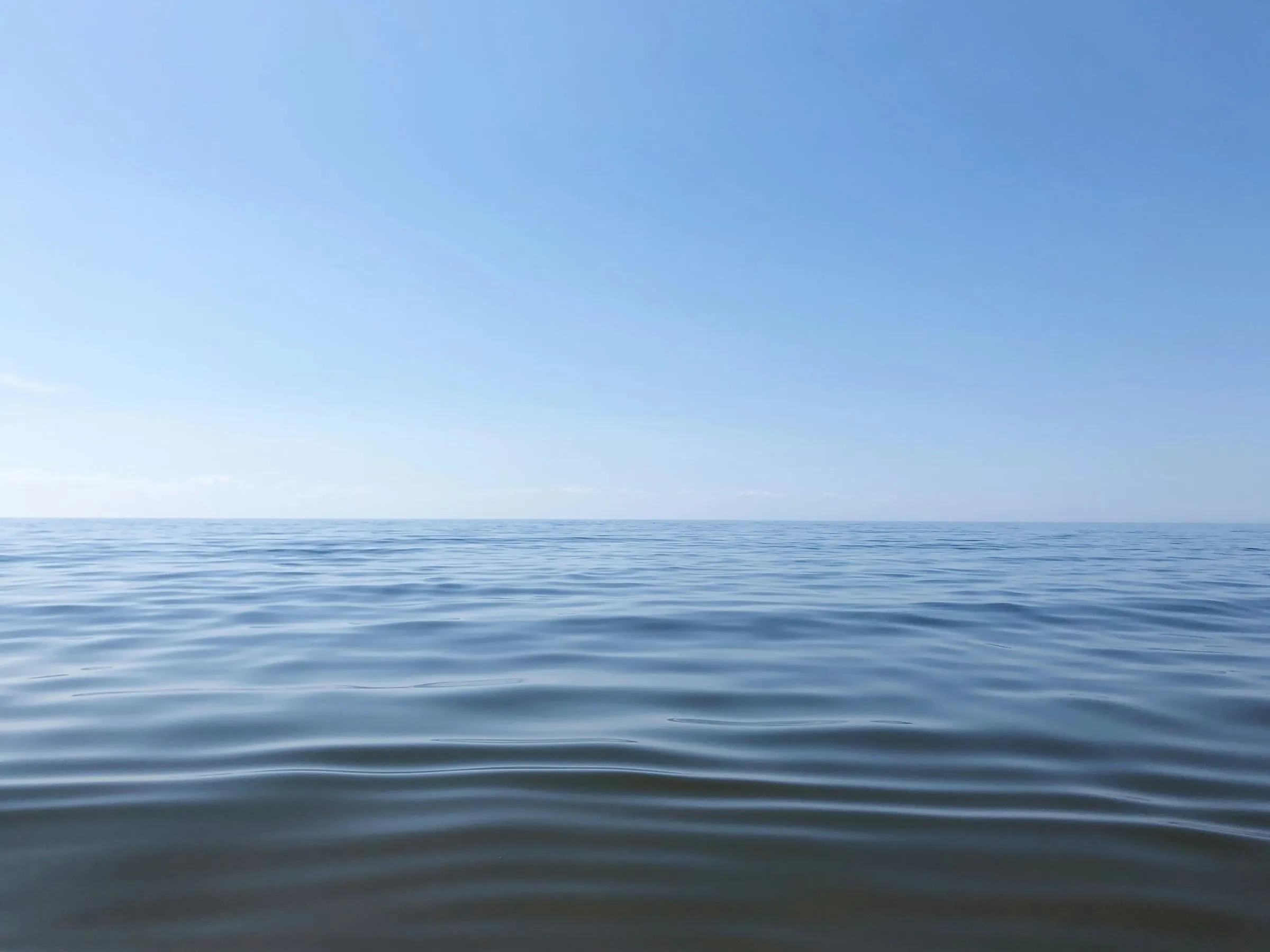 Calm blue water stretching to the horizon